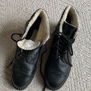 New women’s size 9 1/2 ankle high black leather boots.